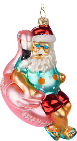 BRUBAKER Weihnachtsmann im Urlaub - Handbemalte Weihnachtskugel aus Glas - Santa auf Flamingo Schwimmring Rosa mit Sonnenbrille - Christbaumschmuck Figuren lustig Deko Anhänger Baumkugel - 15 cm
