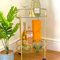 HOMELOX Stylish Gold Drinks Trolley Two Glass Shelves Eye Catching Gold Mini Bar Table With Castor