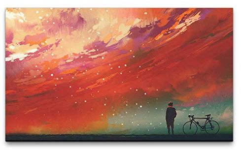 Paul Sinus Art Bilder XXL Mann mit Fahrrad vor roten Wolken 120x70cm Wandbild auf Leinwand