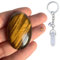 Tigerauge Edelsteine Heilsteine - Handschmeichler. Glückssteine. Verleiht Mut, Schutz und Sicherheit. Palm Stone. Inkl. Bergkristall-Schlüsselanhänger + Heftchen zur Bedeutung + Geschenkbeutel