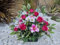 Composition de Fleurs Artificielles Lesté Ciment Pour Une Très Bonne Tenue à L' extérieur. Réalisé Par Nos Soins. Fleurs de Qualité.