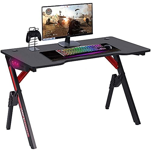 BAKAJI Escritorio para Videojuegos PC Ordenador con Luces LED RGB Cambio de Color Estructura Metal Madera Textura Fibra Carbono con Alfombrilla ratón ratón Incluido 120x60x73cm Juego en línea