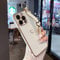 ZTOFERA Compatible with iPhone 14 Pro Max Case with Wrist Strap, Flexible Silicone Protective Phone Case with Cute Heart Pattern Hand Strap Stand Finger Holder Gold Trim Shockproof Bumper Cover, White