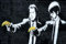 Banksy Poster, laminiert, Künstler in Graffiti, Pulp Fiction Banana – Parodie Banane Pistole, Poster – Maße: 59,4 x 42 cm (ca.)