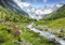 wandmotiv24 Fototapete Berge Alpen Wiese Bach, M 250 x 175 cm - 5 Teile, Wanddeko, Wandbild, Wandtapete, Wasser Schnee Wald Bäume Gras M6751