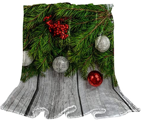 Coperta in pile con albero di Natale, struttura in legno grigio per divano in peluche leggero sfocato