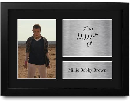 HWC Trading Millie Bobby Brown V2 Strange Hawkins Thing Geschenke Gedrucktes Signiertes Autogramm Foto für Fans von Fernsehshows - A4 Gerahmt