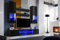 Komodee, Wohnwand Wohnzimmerset RTV Varallo, Schwarz Hochglanz/Schwarz Matt, Breite 200cm x Höhe 195cm x Tiefe 45cm, LED RGB, für Wohnzimmer, Schlafzimmer