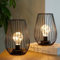 TRIROCKS Metal Cordless Table Lamp 20cm Tall Set of 2 Cage Shape Battery Operated Lanterns with Fairy Lights Bulb for Indoor/Outdoor Use Perfect for Christmas Garden Weddings Events (Black)