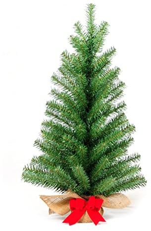 artplants.de Kunst Tannenbaum Athen, Jutesack, rote Schleife, 75 cm, Ø 25 cm - Kunststoff Weihnachtsbaum