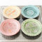 Set di 4 piatti decorativi in ceramica, motivo floreale in rilievo, colori pastello, stile vintage