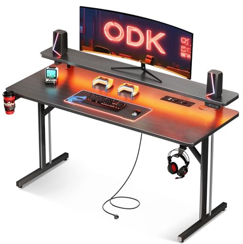 ODK Scrivania Gaming con Luci LED e Prese di Corrente, Postazione Gaming con Supporto per Monitor, Scrivania Computer in Fibra di Carbonio Nera 120cm
