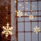 Spetebo LED Schneeflocken Lichtervorhang mit Timer Batterie betrieben - 210 cm - Lichterkette mit 60 LED in warm weiß - Schnee Flocke Weihnachtsdeko Fensterdeko für Außen