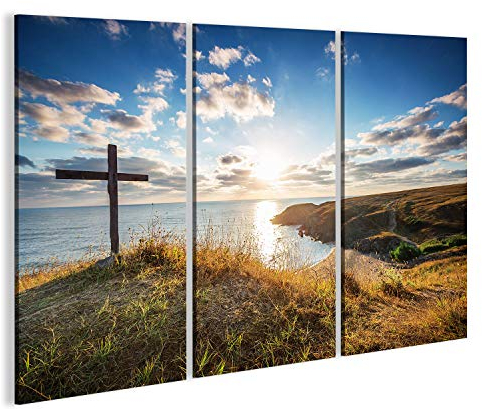 Bild auf Leinwand Christliches Kreuz an einem Wilden Strand mit einem wunderschönen Sonnenaufgang. Wandbild Poster Leinwandbild
