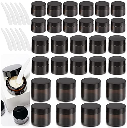 Swpeet Paquete de 40 tarros de vidrio ámbar de 0.5 onzas, con tapa y cuchara de plástico, kit surtido de recipientes redondos, tarros de vidrio cosméticos con revestimientos interiores y tapas