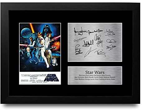 HWC Trading FR A4 New Hope Cast Mark Hamill, Carrie Fisher, Harrison Ford Geschenke Geducktes Signiertes Autogramm Foto für Fans von Film Memorabilien - A4 Gerahmt