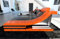 Sofa Dreams Ledersofa Turino L Form Ecksofa - mit LED Beleuchtung, verstellbare Kopfstützen, Recamiere/Lederfarben wählbar/Ausrichtung wählbar (Ottomane rechts, Schwarz-Orange)