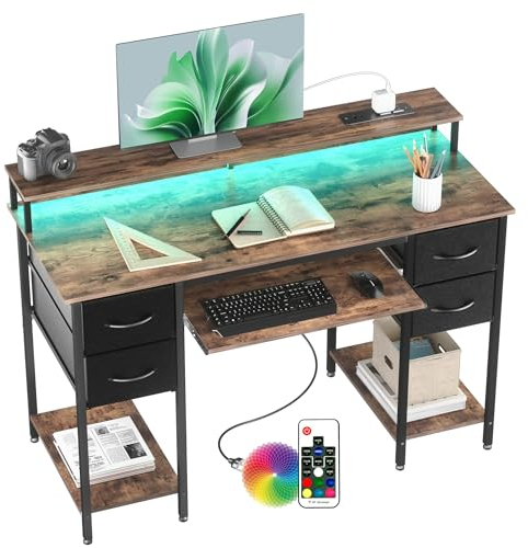 BEXEVUE Escritorio Moderno LED con Regleta Enchufes - 120x50 cm Mesa Gaming Ordenador con Bandeja para Teclado, 4 Cajones Reversibles, Grande Soporte Monitor para Estudiar Jugar Trabajar Dormitorio