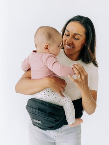 Tushbaby Babytrage Hüfttrage für Baby und Kleinkind bis 20 kg, Schwarz | Geprüfte Sicherheit, Baby Trage in leichtem Design ohne Schaumstoff, mit integrierten Staufächern