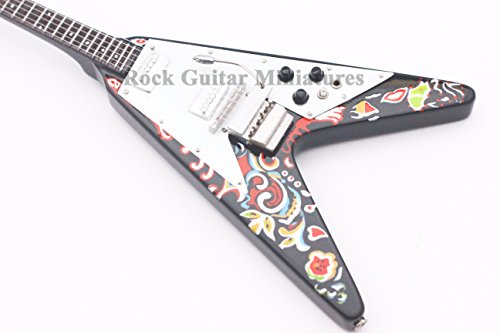 RGM59 – Miniaturgitarre inkl. Leder-Gitarrengurt, Motiv: Jimi Hendrix‘ „Flying V“