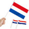 Anley Netherlands Mini Banderas 12 unidades - Pequeñas banderas holandesas en miniatura de mano en palo - Resistente a la decoloración y colores vivos - 5 x 8 pulgadas con poste sólido y punta