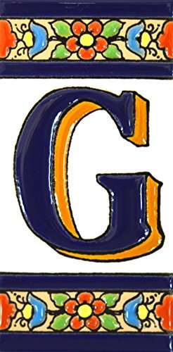 Insegna con numeri e lettere fatte di piastrelle di ceramica policroma, dipinte a mano con la tecnica cuerda seca, nomi indirizzi e segnaletica. Testo personalizzabile. Disegno FLORES MEDIANO 10,9 cm x 5,4 cm. (LETTERA G)
