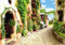 wandmotiv24 Fototapete Strasse Stadt Pflanzen, XL 350 x 245 cm - 7 Teile, Wanddeko, Wandbild, Wandtapete, Stein-weg, Dorf-Gasse, Fresko M1099