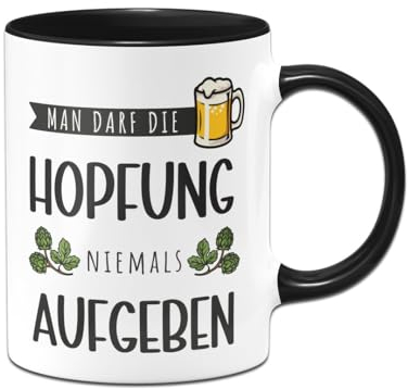 Tassenbrennerei Tasse - Man darf die Hopfung niemals aufgeben - Bier Kaffeetasse lustig mit Spruch - Geschenk für Mann, Männer - Bierglas (Schwarz)
