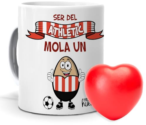 mundohuevo| Taza con frase “Ser del Athletic de Bilbao mola un huevo”| Regalo original| Pelota antiestrés con forma de corazón de color rojo| Taza de cerámica| Capacidad de 330ml.