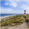 Wallario Glasbild Am Strand von Sylt Leuchtturm auf der Düne Panorama - 50 x 50 cm Wandbilder Glas in Premium-Qualität: Brillante Farben, freischwebende Optik