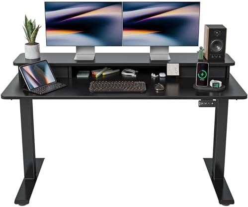 FEZIBO Height Adjustable Electric Standing Desk with Double Drawer, 140 * 60cm Stand Up Table with Storage Shelf, Sit Stand Desk with Splice Board, Black Frame/Black Top