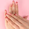 24PCS Press On Nails - Short to Medium Square French Red Fake Nails with Heart Accents, Pink Adhesive Acrylic Nail Set, Reusable for Women and Girls