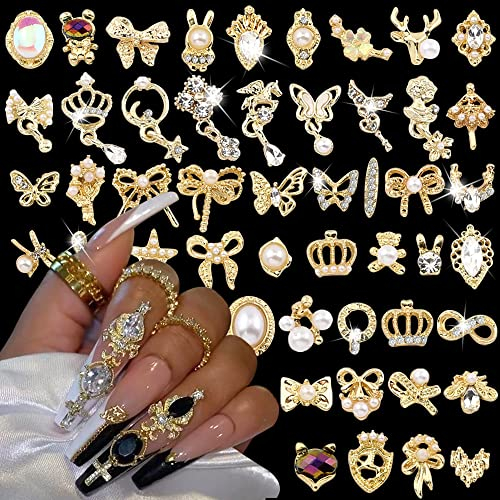 50pcs Gold Nail Charms Luxus Strasssteine Nägel Edelsteine 3D Legierung Blume Schmetterling Nail Art Charms Metall Nagel Schmuck Kawaii Bär Herz Bogen Stern Schlange Glitzersteine Nageldesign Zubehör