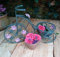 Inspirational Gifting 40cm tall Verdigris Metal Tricycle Plant Pot holder with Pink Flower motifs - a delightful way to display your bedding plants
