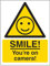 V Safety Smile! You're On Camera! Sign - 150mm x 200mm - 1mm Rigid Plastic