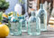Dekoleidenschaft 4X Vase Aqua in türkis, 10-19 cm klein, aus klarem Glas, Tischvase in Flaschenform, Blumenvase, Flaschenvase, Vasenset, Dekoflaschen, Glasvase