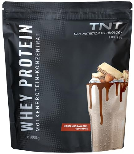 TNT Whey Protein Pulver, 1kg, Haselnuss-Waffel • Eiweißpulver Konzentrat mit Laktase • Ideal zum Muskelaufbau und -erhalt • Mit EAAs und BCAAs (Verpackung kann variieren)