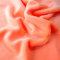 TOLKO 50cm Plüsch Kunstfell Meterware kuschelig weiches Fellimitat mit 1cm Florhöhe Kunstfelldecke Jacke Mantel Baby Teddy Plüschstoff Webpelz Stoffe zum Nähen Basteln Fellimitat (Orange)