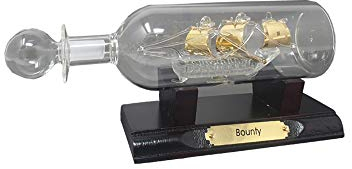 Ship in a Bottle - Ornamento in vetro a forma di barca utile per accessori decorativi, con nave placcata oro su supporto in legno, che lo rende un regalo reale per i tuoi cari in occasioni speciali