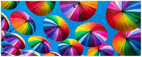 Wallario Poster - Bunte Regenschirme vor blauem Himmel in Premiumqualität, Größe: 50 x 125 cm
