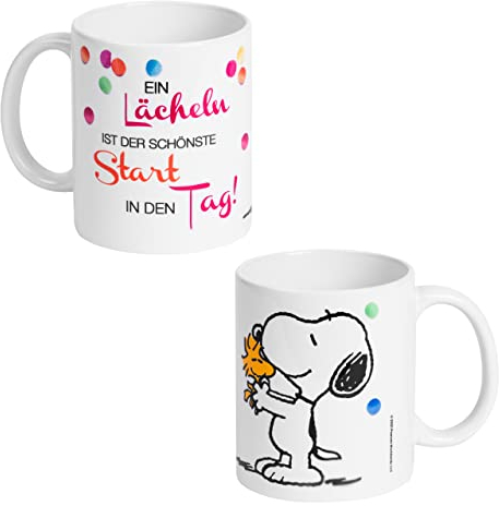 Peanuts The Tasse Snoopy - EIN Lächeln ist der schönste Start in den Tag! Kaffeetasse Becher Kaffeebecher aus Keramik Weiß 320 ml