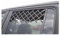 Rejilla de ventilación vintage sobre cristal de puerta.