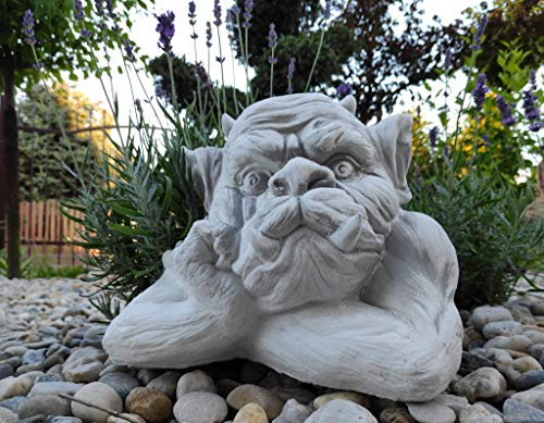 Stone/concrete garden ornament sculpture of Pensive Gargoyle looking to the right