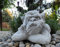 Stone/concrete garden ornament sculpture of Pensive Gargoyle looking to the right