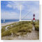 Wallario Design Wanduhr Am Strand von Sylt Leuchtturm auf der Düne Panorama aus Aluverbund, Alu-Uhr Größe 30 x 30 cm, weiße Zeiger mit Metalloptik