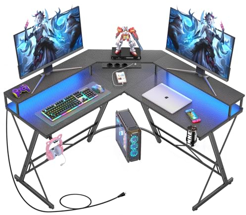 Yornoli Gaming Tisch mit LED, Eckschreibtisch mit Monitorablage, Schreibtisch L Form mit 3 Steckdosen & 2 USB Ladeanschluss, Computertisch Kohlefaser Schwarz