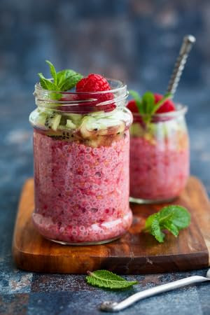adrium Acryl-Bild 70 x 110 cm: Himbeer-Chia-Samen-Pudding im Glas zum Frühstück (37439449)
