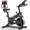 CURSOR FITNESS Vélo d'Appartement pour la Maison, Vélo de Fitness d'Exercice Silencieux avec Résistance Réglable, Guidon et Siège Réglables, Écran LCD,Sièges Respirants, pour Entraînement Cardio