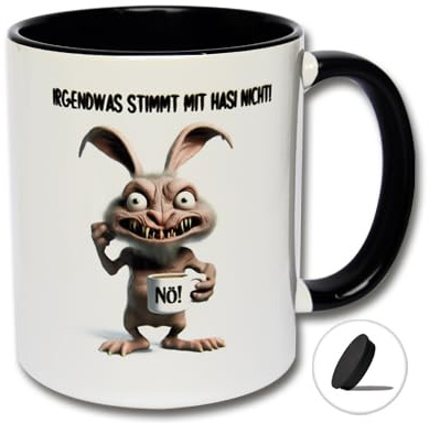 Lustige Tasse Ostern mit Spruch Irgendwas stimmt mit Hasi nicht! Kaffeetasse mit Tassendeckel, Kaffeebecher, Osterdeko (B: Schwarz-Weiße Tasse inkl. schwarzem Tassendeckel)