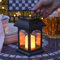 Festive Lights - Farol solar para vela con luz parpadeante LED ámbar, color negro (15 cm)